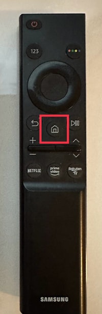 a samsung tv remote with a red circle on it