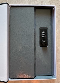 a gray box with a small electronic device inside