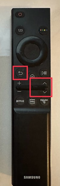 a samsung tv remote with two buttons on it