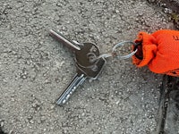 an orange bag with keys on it