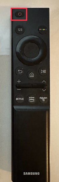 a samsung tv remote with a red circle on it