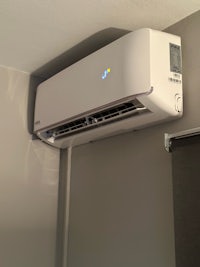 a wall mounted air conditioner in a room