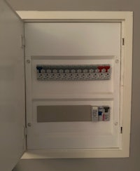 a wall mounted electrical box with a circuit breaker