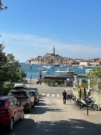 a street with cars parked in front of an island