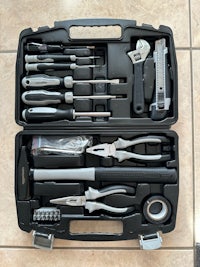 a black case with a variety of tools in it