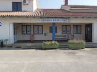 the front of a building with a sign on it