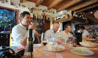 a group of people sitting at a table