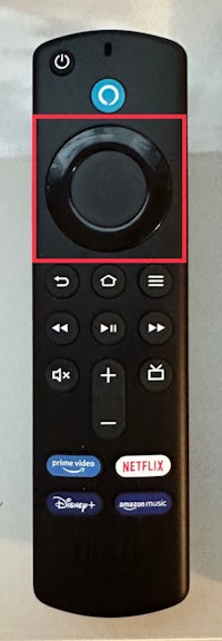 a remote control with a red button on it